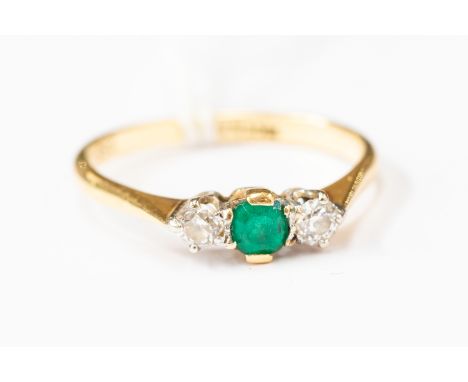 An 18ct gold emerald and diamond three stone claw ring, size S, total gross weight approx 3.2gms