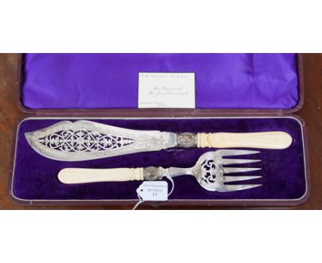 A late Victorian silver plated fish serving knife and fork, ivorine handles, fitted in the original presentation case