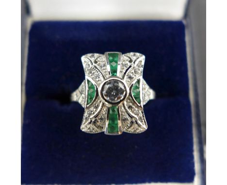 An Art Deco style silver, cubic zirconia and emerald ring, size P 