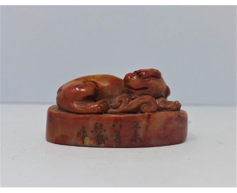 A Chinese soapstone seal, carved with a guardian dog, H.3.6 W.7 D.4cm 