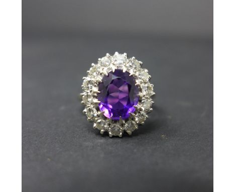 A 14ct white gold, amethyst and diamond cluster ring, approx. 1.5ct total, boxed 