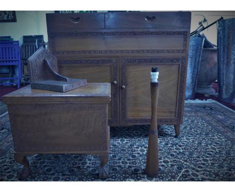 A set of mid 20th century teak furntirue , all carved with leaf border, to include a cupboard with hinged lid and two cupboar