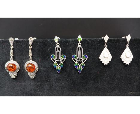 Three pairs of silver earrings, to include one pair set with faux amber; one pair of fan design set with cubic zirconia and w