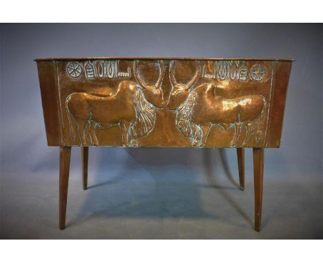 A late 19th century copper planter, repoussé embossed with cattle, on splayed legs, H.55 W.70 D.28cm 