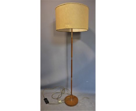 A mid 20th century Temde teak standard lamp, with circular shade, H.157cm 