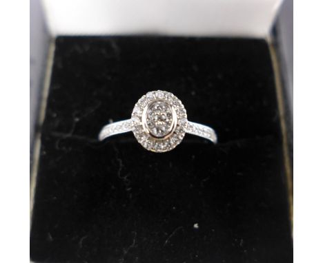 An 18ct white gold and diamond cluster ring, 0.30cts total 