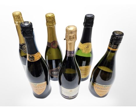 Six various bottles of Prosecco.