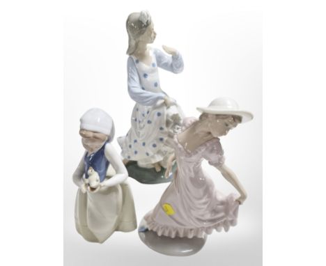 Three Nao figures of ladies, tallest 35cm.