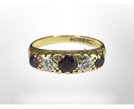 An 18ct yellow gold ruby and diamond ring, size N. CONDITION REPORT: 4.1g