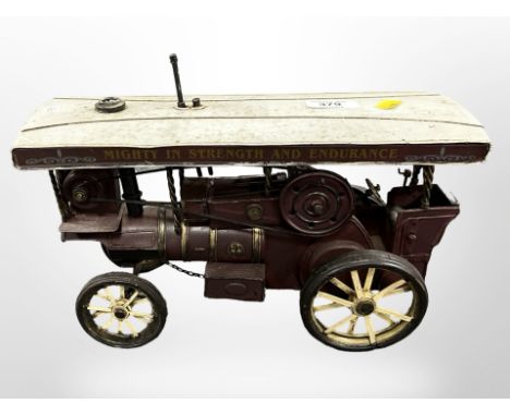 A tin plate model of a steam engine, length 32 cm 