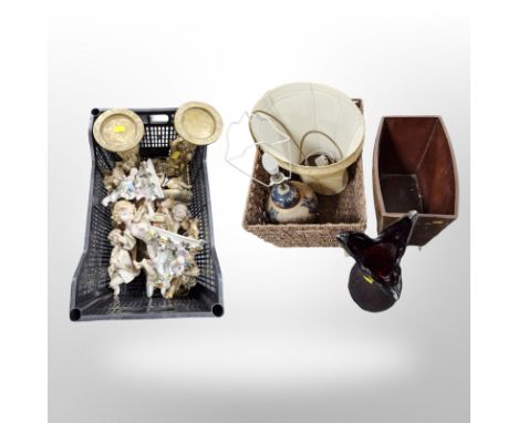 A group of continental porcelain and plaster cherub ornaments, pair of gilt candle stands, pottery lamp base and shade, large