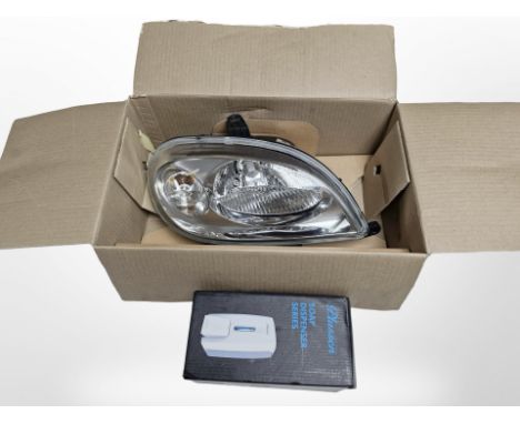 A boxed Citroen car head light and a soap dispenser 