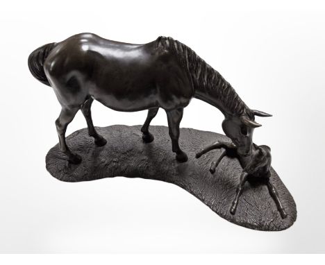 A bronze-effect resin sculpture of a horse and foal, width 36cm.