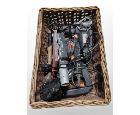 Several Challenge power tools in wicker basket
