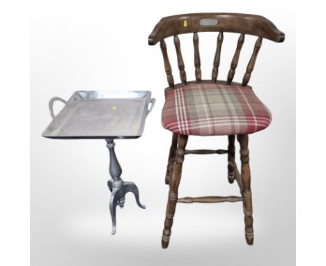 A contemporary high stool and a chrome tripod table 