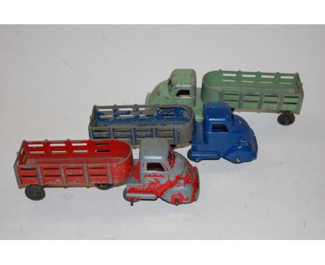 Two trays containing a large quantity of Louis Marx diecast articulated trucks and trailers, some examples over-painted 