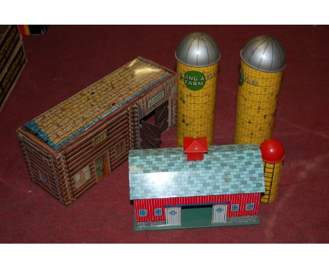 Two boxes containing a quantity of Louis Marx and other tinplate buildings and accessories, to include farm related examples 