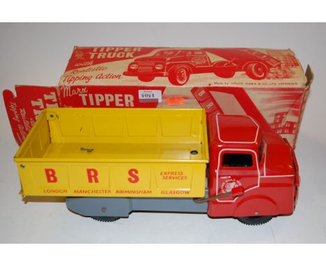 A Louis Marx Co of Swansea tinplate and pressed steel model of a BRS tipper truck, comprising red, grey and yellow body, with