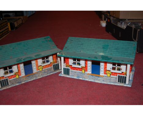 Two trays containing a quantity of Louis Marx and other tinplate buildings and accessories, to include Middletown railway sta