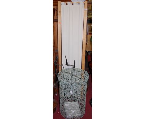A contemporary beech framed and linen inset threefold dressing screen; together with a contemporary metal wall hanging; and a