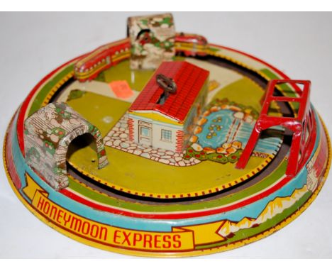 A Marx Toys tinplate and clockwork Honeymoon Express play-set 