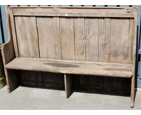 A rustic planked pine bench seat settle, width 175cm