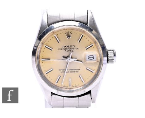 A lady's stainless steel Rolex Oyster Perpetual Date wrist watch, batons to a circular silvered dial, case diameter 24mm, to 