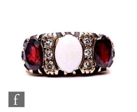 A 9ct hallmarked Victorian style garnet, opal and paste nine stone ring, weight 5g, ring size O.