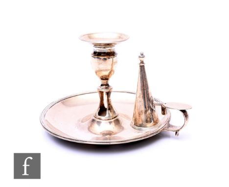 A George III hallmarked silver chamber stick and matching snuffer of plain typical form, weight 10oz, diameter 15cm, London 1