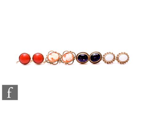 Four pairs of 9ct single stone earrings to include amethyst, cameo and opal examples, total weight 11g. (4)