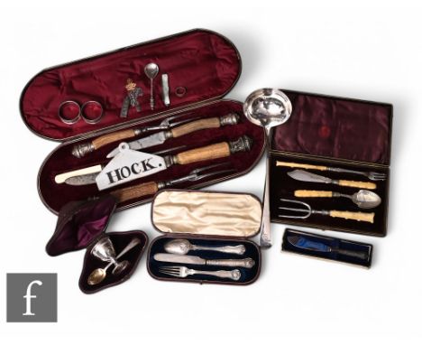 A parcel lot of silver and other items to include a soup ladle, napkin rings, cased egg cup and spoon, cased carving set, ing