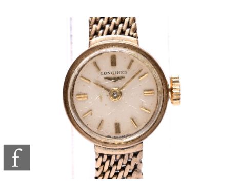 A 1960s lady's Longines 9ct gold cased cocktail watch with manual wind movement and baton numerals to the champagne coloured 