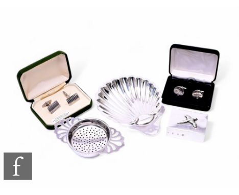 Five items of hallmarked silver to include a butter dish, a matchbox holder, a tea strainer and two pairs of cufflinks, total