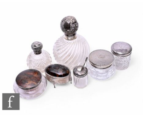 Six assorted hallmarked silver and clear glass scent bottles with a silver tortoiseshell topped trinket box, various styles a