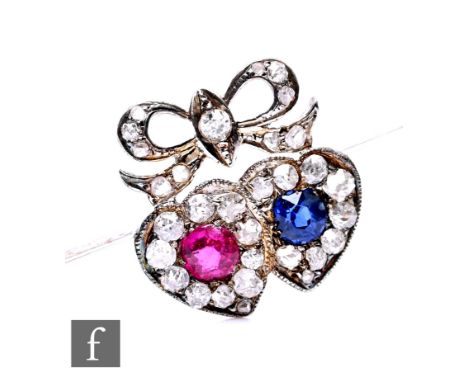 An early 20th Century 18ct white gold sapphire, ruby and diamond bar brooch, a single sapphire and ruby each within a heart s