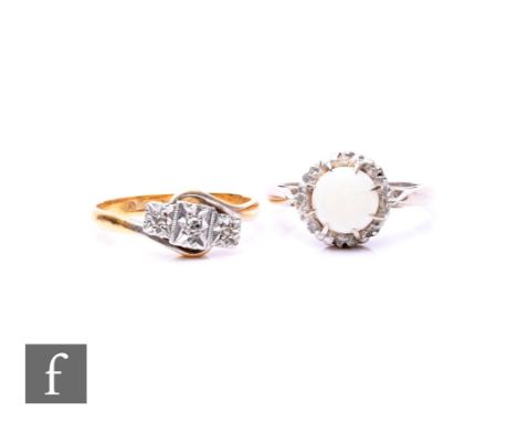 Two 18ct rings, a single stone opal and a three stone illusion set diamond example, total weight 6.5g. (2)