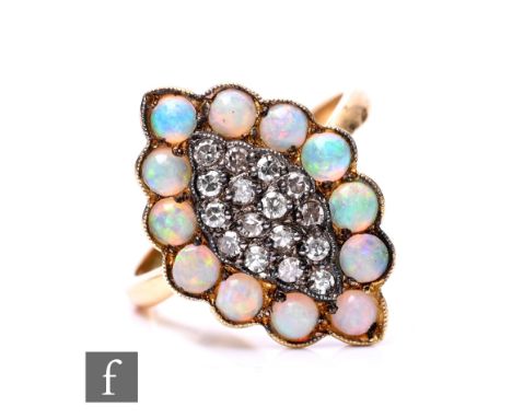 A modern 18ct hallmarked opal and diamond marquise shaped cluster ring, central diamonds within a border of opals, weight 5g,