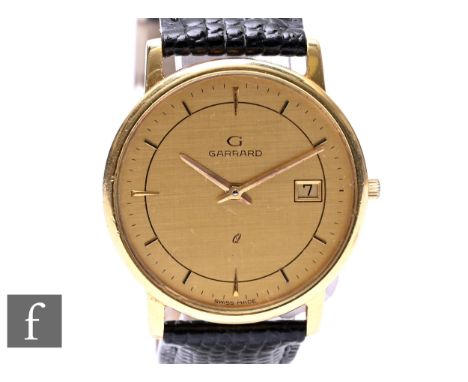 An 18ct Garrard quartz wrist watch, batons and date facility to a circular champagne dial, case diameter 34mm, prestation eng