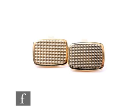 A pair of 9ct hallmarked cushioned rectangular swivel cufflinks with engine turned decoration, weight 8.5g. (2)