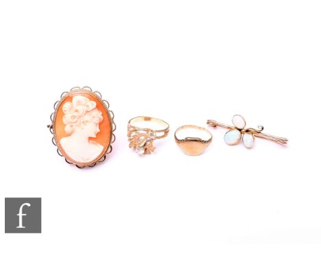 Four items of 9ct jewellery an opal and diamond brooch, damaged, a cameo brooch and two rings, damage. (4)