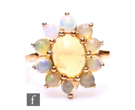 A 9ct opal cluster ring, weight 2g, ring size N.