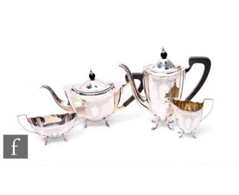 A hallmarked silver four piece, boat shaped, tea set each with part engraved decoration, total weight 57.5oz, each raised on 