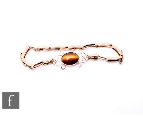 A 9ct rose gold sprung watch bracelet set with later central tigers eye panel, weight 7.6g, damaged.