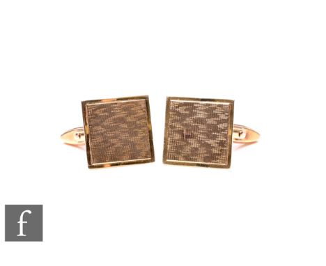 A pair of 9ct hallmarked swivel cufflinks with engine turned decoration to square heads, weight 7.5g.
