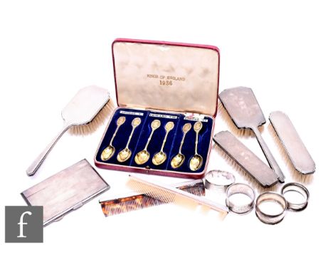 A small parcel lot of hallmarked silver items to include six silver back hair brushes and combs, a cased set of tea spoons, a