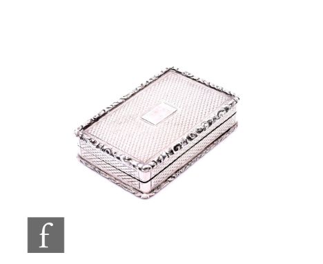 A Victorian hallmarked silver rectangular vinaigrette with engine turned decoration opening to gilt pierced grille, length 45