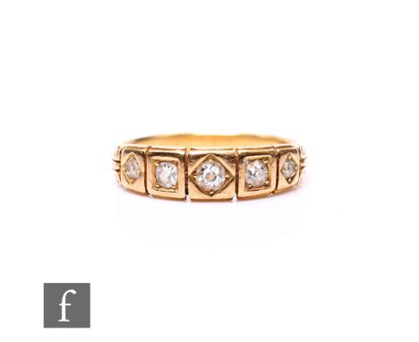 An early 20th Century 18ct diamond five stone ring, old cut stones to a panelled head, weight 3g, ring size M.
