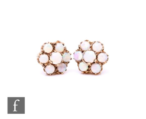 A pair of 9ct hallmarked seven stone opal daisy cluster stud earrings, total weight 2.7g.