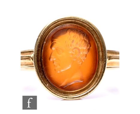 A high carat intaglio carnelian stone set ring,&nbsp;carved profile of a classical man to reeded shoulders, weight 3.2g, ring