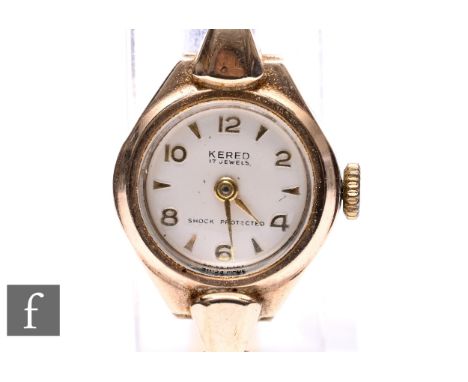 A lady's 9ct hallmarked Kered manual wrist watch, Arabic numerals and batons to a circular dial and integral 9ct brick bracel